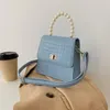 حقائب حمل البسيطة بو الجلود حقائب الكتف crossbody للنساء 2021 سلسلة تصميم حقيبة يد الفاخرة الإناث السفر مع مقبض اللؤلؤ