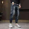 Mens jeans harem byxor mode fickor desinger lös passform baggy moto jeans män stretch retro streetwear avslappnad avsmalnande jeans 42 g0104