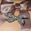 Bow Ins Style High-Carbon Diamond Pin Spilla con unicorno di perle personalizzate Gioielli in argento S925