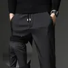 Mens Winter Fleece Warm Pants Men Korean Casual Slacks Slim Warm Thick Pants for men fashion Black Gray Trousers Male 201128