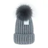 Bonnet entier pas cher Nouveaux bonnets d'hiver Chapeaux tricotés Bonnet femme Bonnets épais avec de vrais pompons en fourrure de raton laveur Bonnets chauds pour filles pomp75029520113