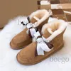 Con caja 2022 Diseñador para mujer Piel Australia Botas Mujeres Clásico Bota de nieve Australiano Invierno Cálido Peludo Arco Satén Tobillo Botines Mullidos Zapatillas Bowtie Lady Girls Zapato