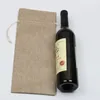 Sacchetti di vino con coulisse in lino Coperture antipolvere per bottiglie di vino Borsa per imballaggio Sacchetti di champagne Confezione regalo per feste Decorazione natalizia Stock8360841