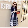 2021 spring and autumn new women's plaid dress long-sleeved A-shaped long autumn Korean version of the slim dress