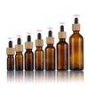 100pcs/lot 5ml 10ml 15ml 20ml 30ml 50ml 100ml Empty glass Dropper Oil Essential Bottle Bamboo cap Refillable Drop Liquid Bottles