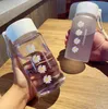 جديد صغيرة ديزي زجاجات المياه البلاستيكية الشفافة 500ML الإبداعية بلوري زجاجة المياه مع حبل السفر المحمولة كوب الشاي HH9-3680