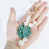 New trendy fashion ins luxury designer pretty camellia flower mutli pearls tassel bag charms keychains for women girls295m