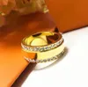 2022 anel de banda de luxo extravagante de alta qualidade ouro prata rosa cores anéis de casal de aço inoxidável moda feminina joias de designer senhora presentes de festa
