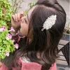 2021年の新しいシルクビッグボウブライトシルクヘアピン韓国のバング母の真珠のヘアピン卸売の春のヘアアクセサリーの卸売
