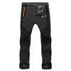 Pantalons extensibles de cargaison chauds d'hiver Men des femmes pantalon de neige en molleton décontracté décontracté.