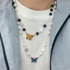Nieuwe Rose Blue Butterfly Pearl Necklace Trend Hip Hop Mannen en Vrouwen Short Wild Sweater Chain Paar Ins