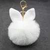 Pompom Keychains 파티 호의 선물 가짜 토끼 귀 모피 공 열쇠 고리 pom pom 솜털 가방 매력 토끼 키 체인 키 링 여성을위한