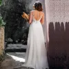 Sexig Boho Beach Bröllopsklänning O Neck Cap Sleeve Pearls Applique Chiffon Bride Dresses High Slit Bridal Gown Sheer Back Robe de Mariage