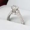 1.1CT Nuovo arrivo Scintillante Gioielli di lusso Taglio rotondo Topazio bianco Diamante CZ Pietre preziose Promessa per le donne Anello di fidanzamento per matrimonio da donna Regalo