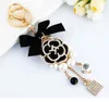 Luxury Dripping Oil Camellia Accessories Exquisite Bow Pearl Chain Bag Keychain Pouch for Girls Llaveros Gift YS072