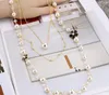 Women039s Exquisite Long Pearl Necklace Bride Weddings Gift Camellia Flower Jewelry Pearl Sweater Chains GC8132425327