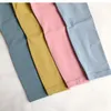 Lycra Fabric Coll Color Women Yoga ملابس السراويل عالية الخصر الرياضة الرياضة ارتداء طماق مرنة اللياقة البدنية سراويل رياضية في الهواء الطلق