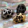 Dijes de joyería de Metal chapados en oro/plata/negro 14*11MM dije de calavera de acero inoxidable con agujero