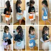 Meisje handtassen nylon effen kleur een-schoudertassen kinderen schattige brief casual draagbare messenger bag accessoires 7 kleuren