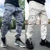 Pantaloni cargo multitasche pantaloni larghi da uomo pantaloni patchwork streetwear pantaloni casual da pista uomo harajuku techwear linee riflettenti