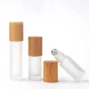 5 10 15ml Frosted clear Roll On Glass Bottle with Bamboo Cap 1/2 oz Roller Ball Perfume Essential Oil Bottles custom logo