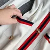 Mini abito da donna lavorato a maglia a righe a contrasto Autunno Inverno Pista Api Bottone con scollo a V Tasca a maniche lunghe Abito vintage LJ200818