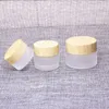 DHgate 5g 10g 15g 20g 30g 50g 60g Milchglas-Gesichtscremetiegel mit Kunststoff-Holzimitationsdeckel PP-Schutzdichtung Glaskörper Butterbehälter Glas Großhandel