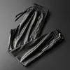 Calça de couro de thoshine calça de couro de qualidade superior cintura elástica calças de corredor zíper bolsos de calças de couro faux calça lápis 2017555727