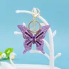 Ny Trendy Popular Fashion Ins Luxury Designer Bag Charms Nyckelringar för Kvinnor Flickor Pretty Levande Färgglada Diamond Rhinestone Butterfly