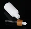 10 ml 15 ml 30 ml witte etherische oliedruppelfles cosmetische glazen pipet verpakking container met hout graan bamboe deksel cap