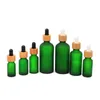 Bottiglia da incasso in vetro Gelo 10ml 15ml 20ml 30ml 50ml con coperchio di bambù Cappuccio di olio essenziale bottiglie di olio glassato verde