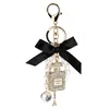 2021 Ny imitation Pearl Perfym Bottle Keychain Car Ring Holder Bag Charm Pendant Accessories Bow Key Chain Fashion Keyring303530274U