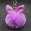 Pompom Keychains 파티 호의 선물 가짜 토끼 귀 모피 공 열쇠 고리 pom pom 솜털 가방 매력 토끼 키 체인 키 링 여성을위한