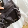 Mochilas de diseñador para hombre y mujer, bolso de mano de nailon, bolso escolar de moda, mochila de viaje de gran capacidad, bolsas unisex