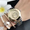 Marque de mode montres femmes dames fille cristal grandes lettres Style métal acier bande Quartz montre-bracelet P732435