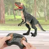 Controle remoto Brinquedo de dinossauro andando com cabeça de agitação, olhos brilhantes e som (Velotron)