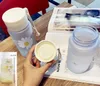 Neue kleine Daisy transparente Kunststoff-Wasserflaschen 500 ml kreative gefrostete Wasserflasche mit tragbarem Seil Reise-Teetasse HH9-3680