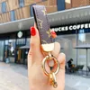 2022 New Arrival Car Keychain Favor Flower Bag Purse Pendant Brown Black Keyring Men Gift Fashion PU Leather Key Chain Mens Accessories