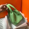 green leather clutch