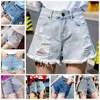 Sommer hoch taillierte Rinderfrauen039s Löcher in koreanischen Jeansshorts3407749