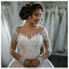 Magnifiques robes de mariée scintillantes à manches longues, fermeture éclair au dos, décolleté transparent avec des appliques de perles, robes de mariée en cristal