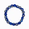 200PC / Lot Glass Blue Evil Eye Beaded Armband Kvinnor Män Elastisk Tråd Sträck Blå Grekiska Ögon Smycken