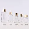 Transparente, klare 20 ml ätherische Öle, quadratische Tropfflasche, 10 ml, 30 ml, 50 ml Glas-Serumflaschen mit Goldverschluss für Kosmetika