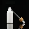 10 ml 15 ml 30 ml blanc flacon compte-gouttes d'huile essentielle pipette en verre cosmétique contenant d'emballage avec bouchon de couvercle en bambou grain de bois