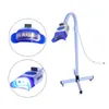 Andra orala hygiener stor marknadsf￶ring rotation arm b￤rbar t￤nder blekning led lampa tandt t￤nder blekning maskin med hjul tandlaser t￤nder verktyg