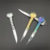 Ring Keychain Mini Key Kniv Form Key Blade Box Förpackning Fick Ficka Multi-Tool Brev Öppnande Gadget Kit Camp Outdoor 100PCs