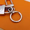 Tasarımcı Alaşım Keychain Keyasyon Moda Çantası Kolye Araba Zinciri Cazibesi Kahverengi Çiçek Mini Çanta Biblo Hediyeleri Aksesuarlar Jone-25183E