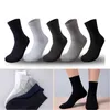 Groothandel heren midden buis sokken mode trend effen kleur sport stretch zakelijke aandelenontwerper winter mannelijke casual midden lengte warme sok