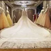 Abito da ballo di lusso Abiti da sposa con gioiello collo trasparente Appliques di pizzo Paillettes Perline robe de mari￩e Abito da sposa a maniche lunghe con retro trasparente