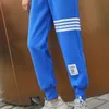 Pantaloni da uomo e da donna classici pantaloni della tuta a righe a quattro barre pantaloni casual